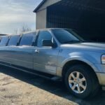 Close-up of silver SUV limousine parked outside garage