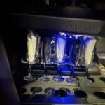 Champagne glasses inside SUV limousine with napkins.