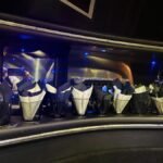 Close-up of rocks glasses arranged with folded napkins in a limo drink station.