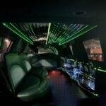 Repeated interior angle showing LED roof lights and side bar in SUV limo.