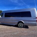 Side view of silver Mercedes 15-passenger party bus with tinted windows – Brantford Limo.