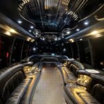 Interior of 30-passenger party bus with wraparound leather seating and LED ceiling – Brantford Limo.