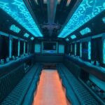 30-passenger party bus with bright teal LED ceiling and wood-style floor – Brantford Limo.